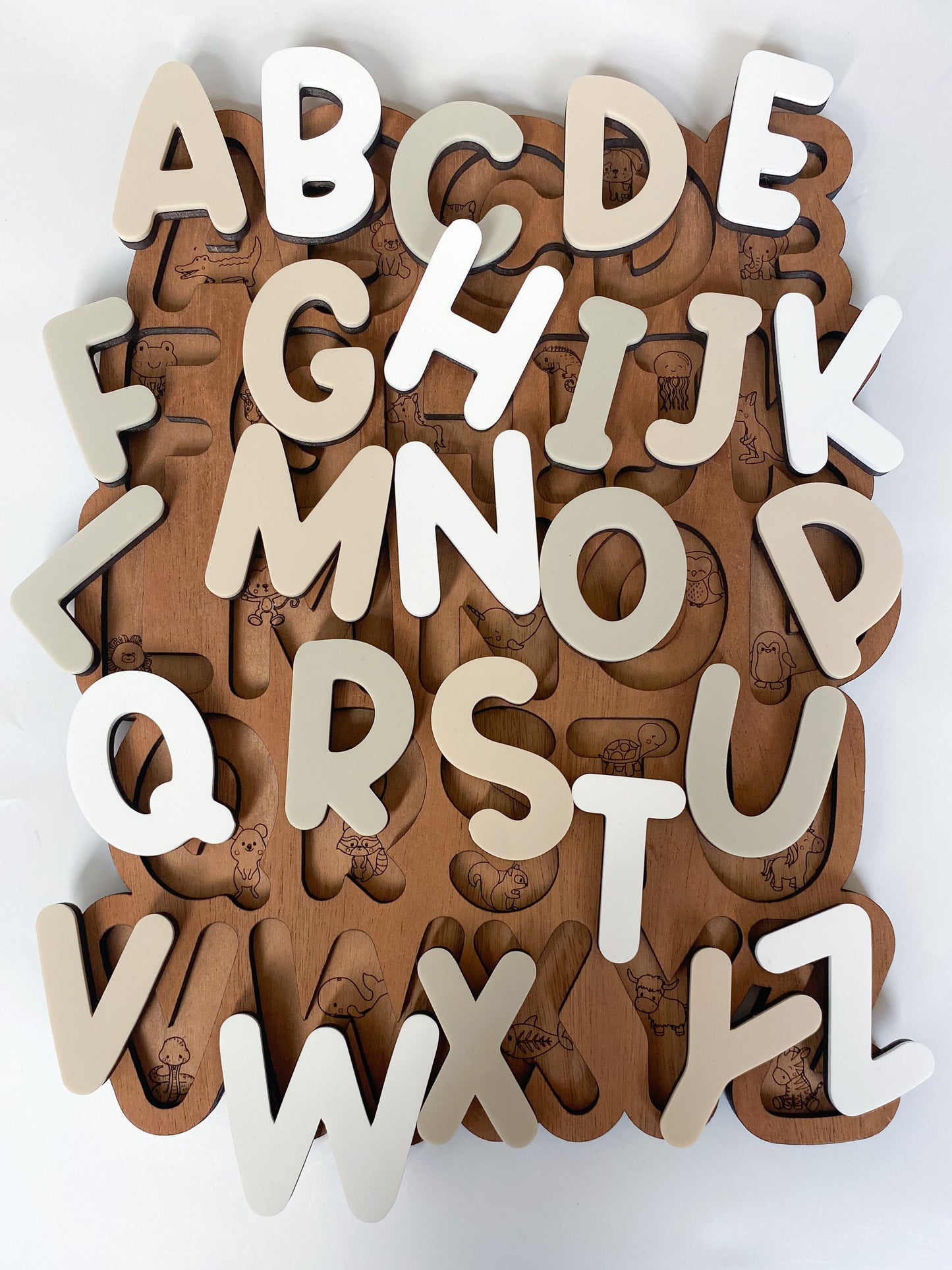 Alphabet Puzzle With Hidden Animal Engravings