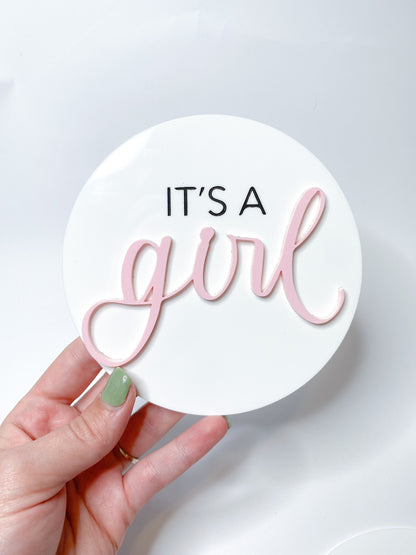 It’s a girl acrylic disk