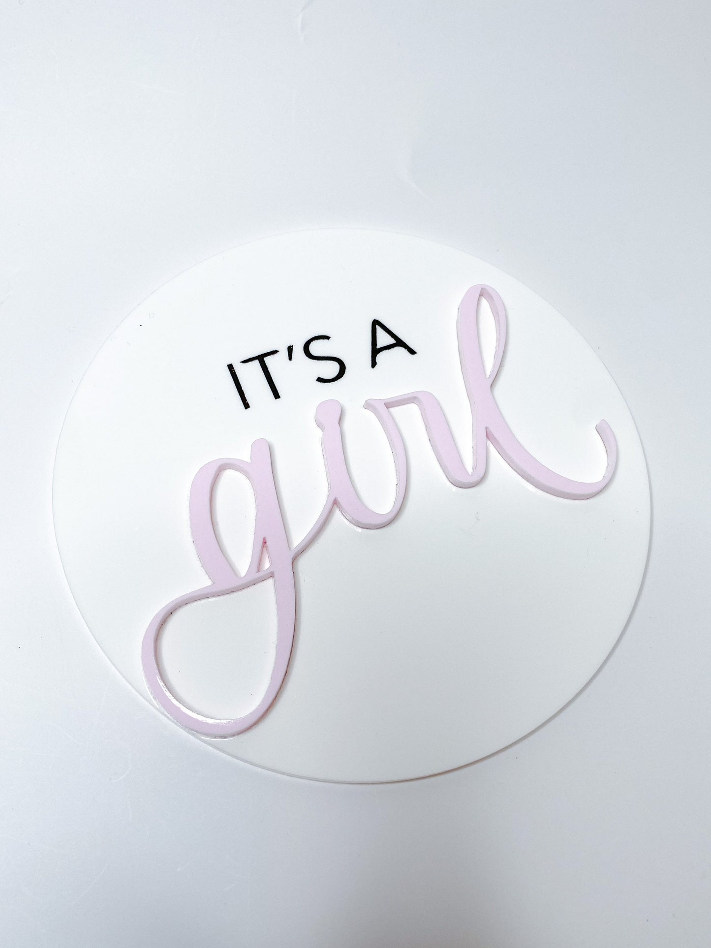 It’s a girl acrylic disk